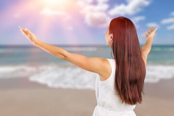 young happy woman enjoying at the sea