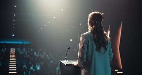 Beautiful Personal Growth Keynote Speaker Delivering a Motivational Speech on Stage, Hosting a Healthcare Seminar to Help Entrepreneurs Overcome Their Personal and Professional Challenges