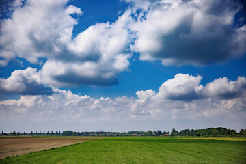 Quaint Dutch Village with Windmill and Dike Houses