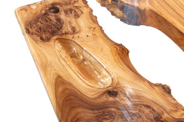 Live edge elm burl slab table top with central epoxy resin river on white background, combining...