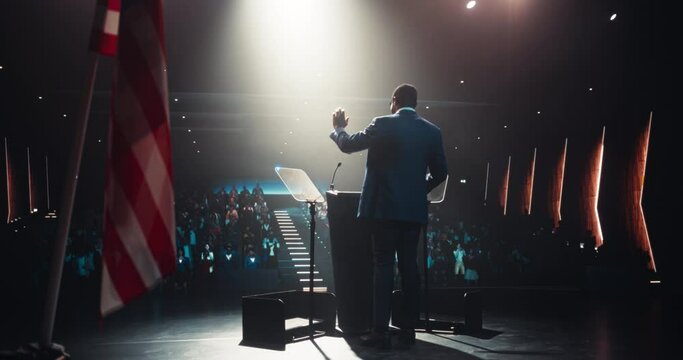 Political Speaker at a Government Election Rally. Black Male Candidate Waving to Supporters, Walking Towards the Tribune Stand to Deliver a Motivational Speech About Equality, Integrity and Freedom