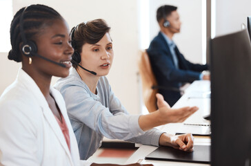 Black woman, manager and training in office in call center for customer service, headset and online faq. Female agent, headphones and staff help in telemarketing agency for consultation and crm coach