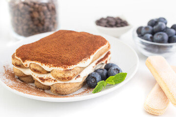 Homemade tiramisu cake . Food background. White background. Sweet Italian dessert .
 