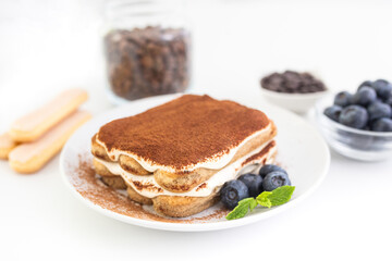 Homemade tiramisu cake . Food background. White background. Sweet Italian dessert .
 