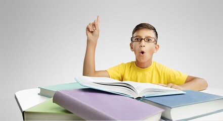 Portrait of small student studying in class