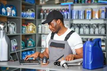 Smiling african Salesman Auto Parts Store