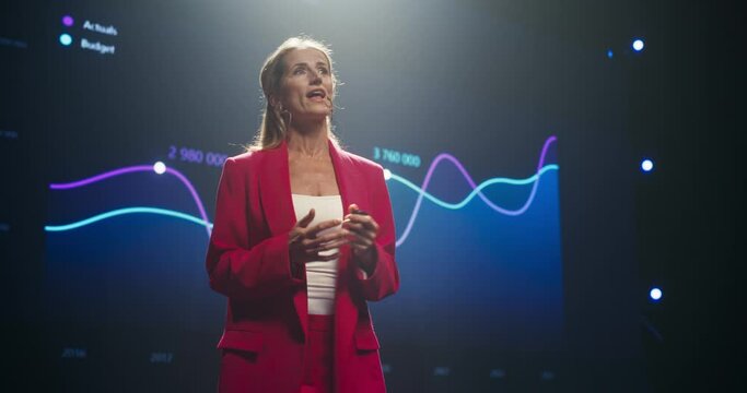 Startup Founder Talking About Business Partnerships and Collaborations on a Big Stage. Beautiful Woman Talking About Project Management Insights and Financial Metrics at an International Event