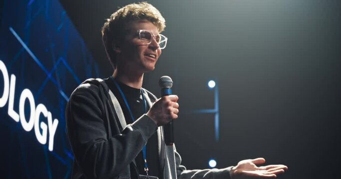 Visionary Young Public Keynote Speaker Delivering a Motivational Speech on Stage, Hosting a Tech Startup Seminar to Help Entrepreneurs Overcome Their Professional Challenges