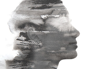 A young woman's profile merging into watery ink texture in paintography