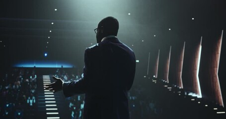 Black Man Making a Life Coaching Session for People Wishing to Have a Healthy and Successful Personal and Professional Life. African Lifestyle Specialist Making a Presentation to a Big Audience