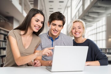 Diverse group of classmates studying project