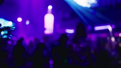 Crowd enjoying music at a club with purple lighting