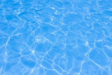 The light reflects blue in the water in the swimming pool. It looks fresh and lively, suitable for use as a wallpaper.