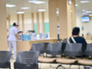 Blurred image of patients coming for check-ups in a modern hospital