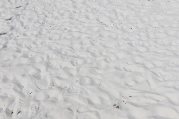 Fine white sand that glistens and reflects the sunlight.