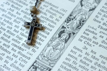 Necklace with Jesus cross as a religious symbol for Christianity and religion, rosary with prayer...