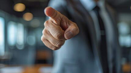 Sharp focus on a business leader's hand gesture in office