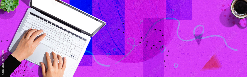 Poster person using a laptop computer from above