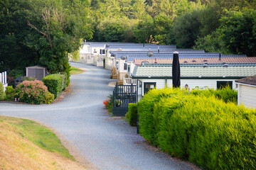 Static caravans parked up in rows on Caravan park, ready for people to enjoy vacations in rural...