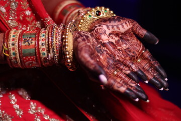 macro view of wedding couple mehdhi design on brides hand