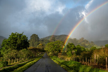 Rainbow over country road, Boquete, Panama, Central America - stock photo