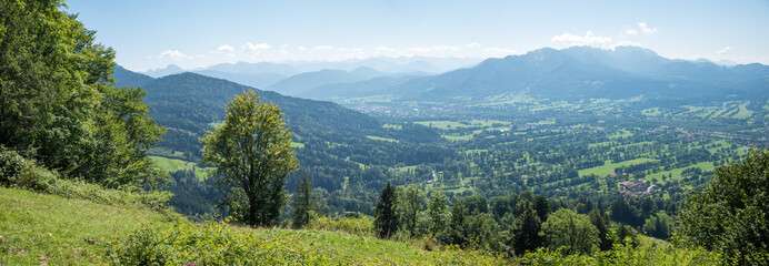 Cultural landscape near Lenggries with parallel tree hedges. View from Sunntraten mountain