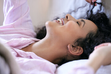 Woman, happy or morning in bedroom with stretch for wake up rest and relax sleep. Excited, female...