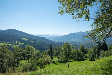 view from hiking trail Sunntraten, to Lenggries in the valley and Brauneck mountain