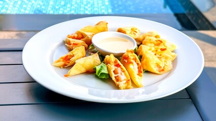 Crispy samosas paired with creamy dipping sauce on white plate, poolside, capture fusion of comfort...