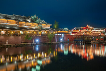 Naklejka premium At night, the beautiful ancient town of Lizhuang on the lake, Yibin City, Sichuan Province, China