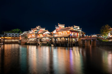 Fototapeta premium At night, the beautiful ancient town of Lizhuang on the lake, Yibin City, Sichuan Province, China