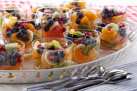 Dessert from various fruits in glasses
