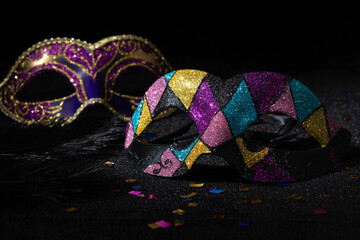 Venetian Masquerade masks on black background. Carnival party layout.