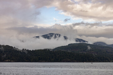 Cloud-covered mountains over British Columbia sea