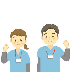 ガッツポーズをする青系のスクラブを着用した医療従事者の男女（正面を向いた上半身）　
