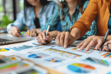 Fototapeta premium Hands business team having a meeting to analyze data graph charts for a marketing plan.