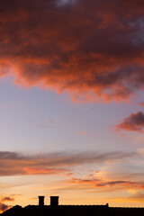 Dramatic sky with orange and dark clouds