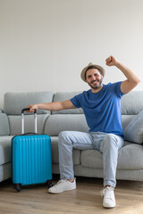 happy and excited boy with his hat on waiting for it to be time to go on vacation