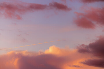 Dramatic sky with orange and dark clouds