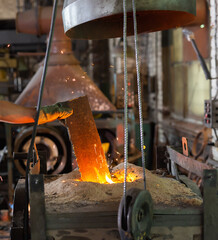 Ferrous metal billet is melted in an induction furnace closeup