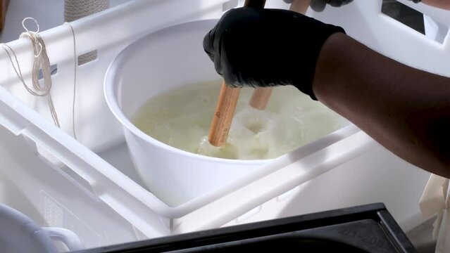 Caciocavallo how to prepare kachakovala cheese step by step in a home craft cheese factory, female hands in black latex gloves prepare a delicious product Italy Switzerland