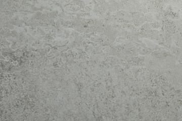 Grey concrete textured surface as background, closeup