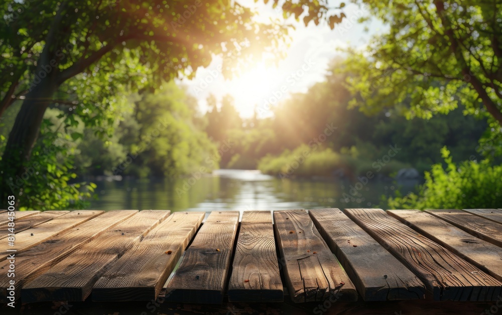 Poster a wooden table with a view of a river and trees. the table is empty and the view is very peaceful