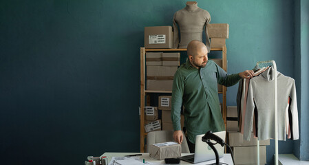 The manager checks the clothes to send to the client. Delivery arrangements. Startup.