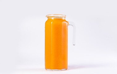 Fruit drink in a decanter. On a light background.
