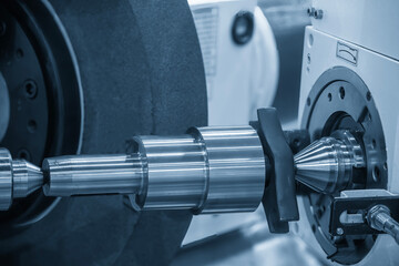 The cylindrical grinding machine in the light blue scene with lighting effect.