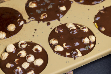 making homemade chocolate with cocoa butter and nuts