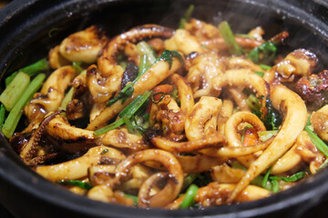 Sizzling Squid Tentacle in casserole. Chinese Cantonese food
