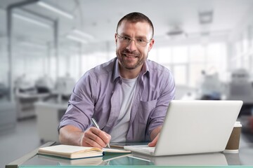 Smiling businessman check database on computer in office.