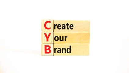 CYB Create your brand symbol. Concept words CYB Create your brand on beautiful wooden blocks. Beautiful white background. Business CYB Create your brand concept. Copy space.